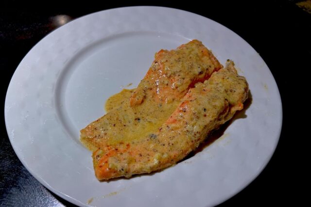 Photo of baked salmon with lemon button cream sauce